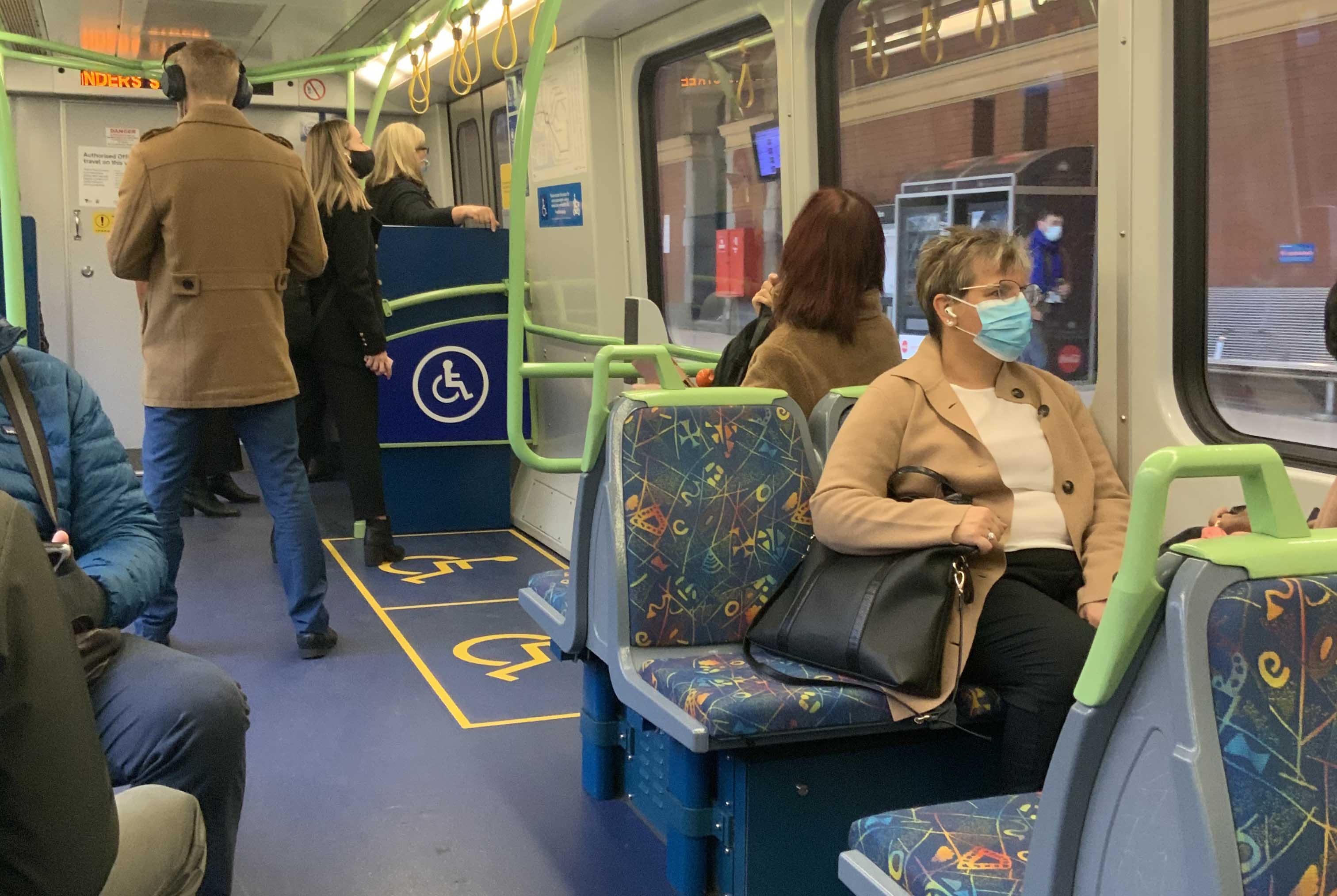 Passengers wearing face masks while travelling on a Metro Train during the COVID-19 pandemic.