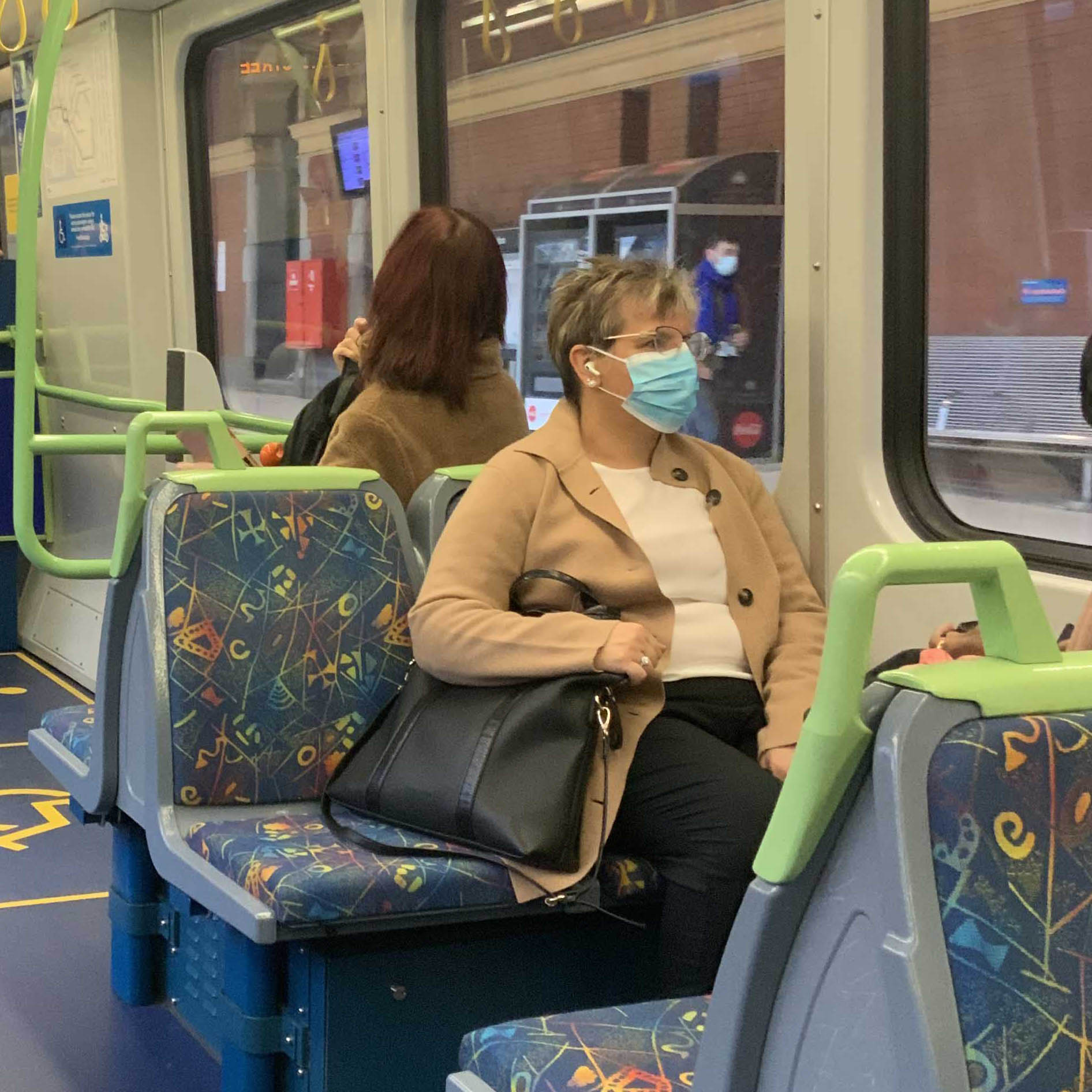Passengers wearing face masks while travelling on a Metro Train during the COVID-19 pandemic.