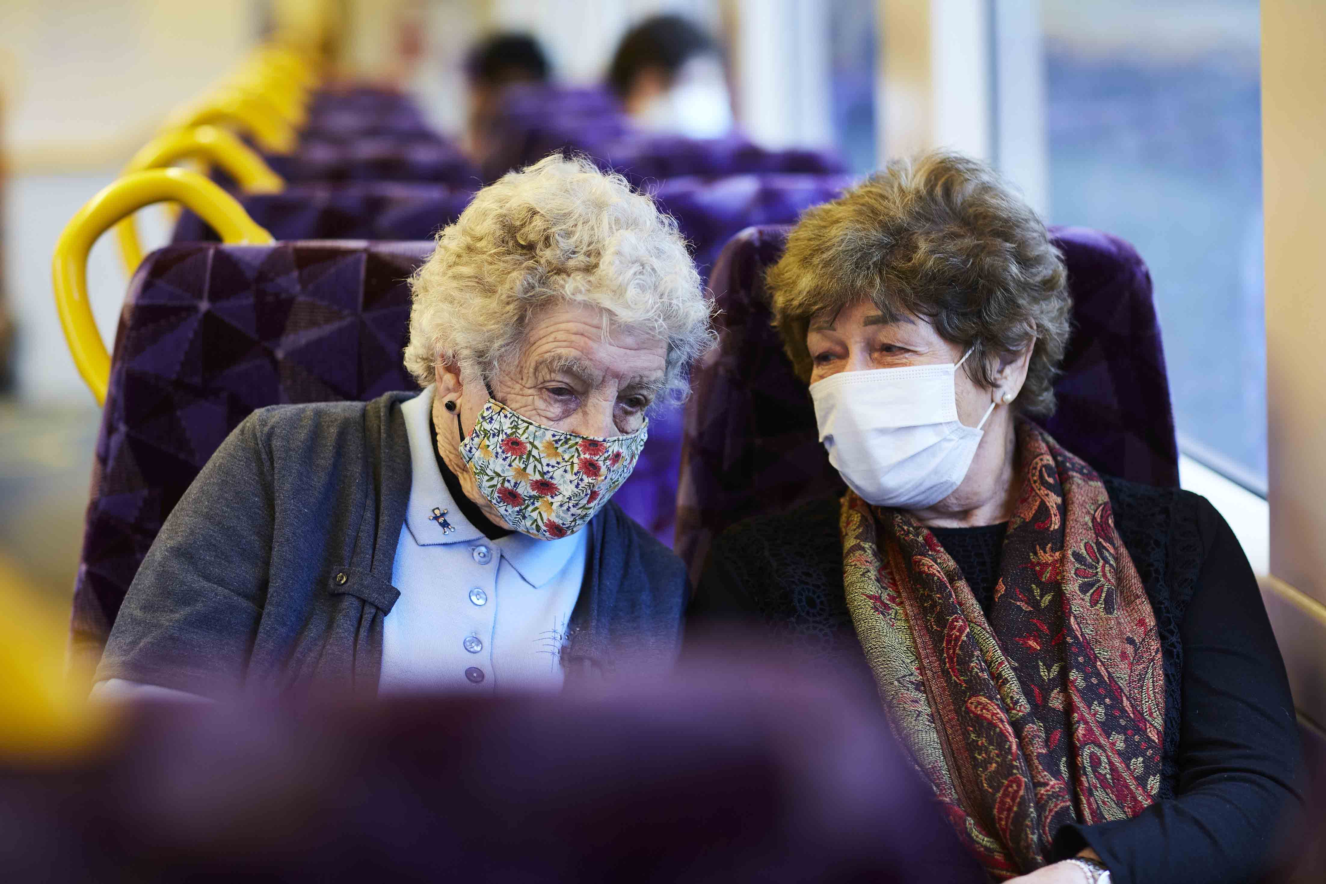 Two elderly women travelling on a V/Line train.